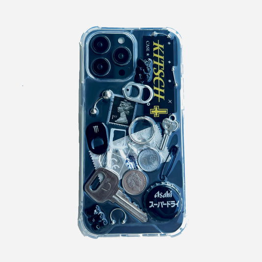 Gothic grunge black junk phone case featuring punk charms and chains on a high-contrast white background